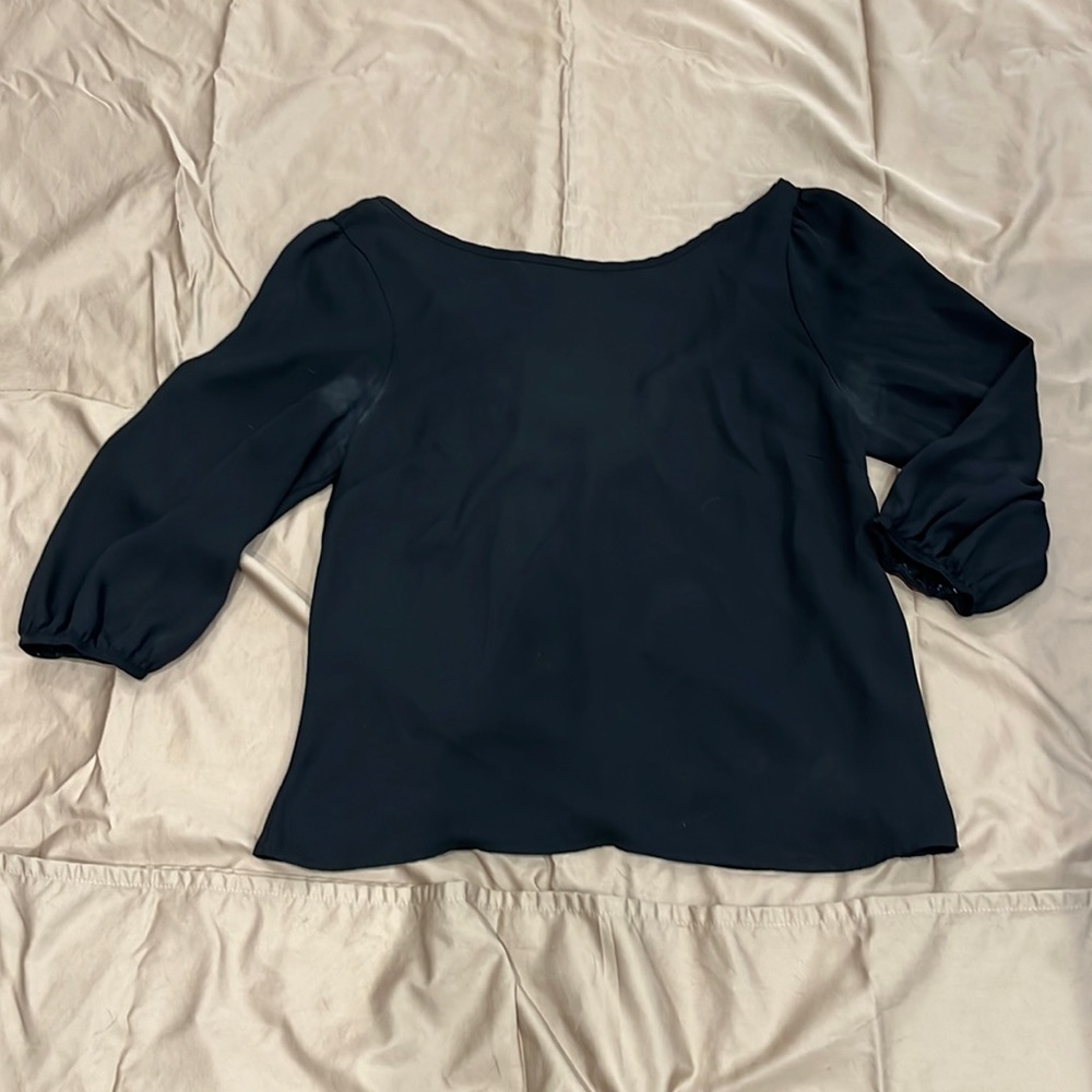 Black women’s top with red bow on back